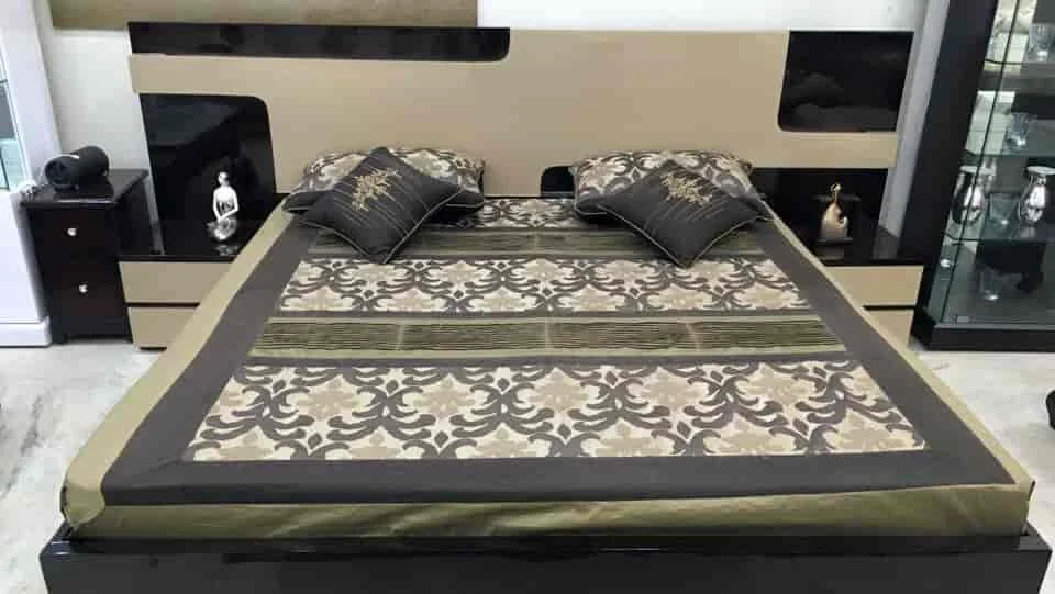 Bed and bedside units with a decorative patterned finish